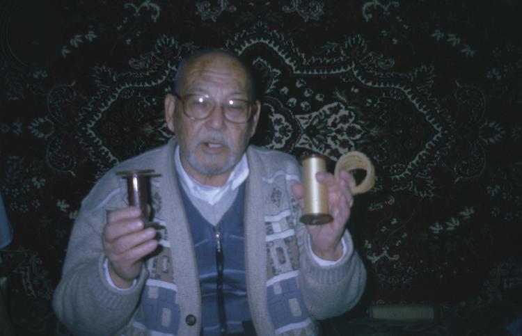 Image of Slide showing the process of silk string manufacture by Rihzhon Khojakhanov and his family