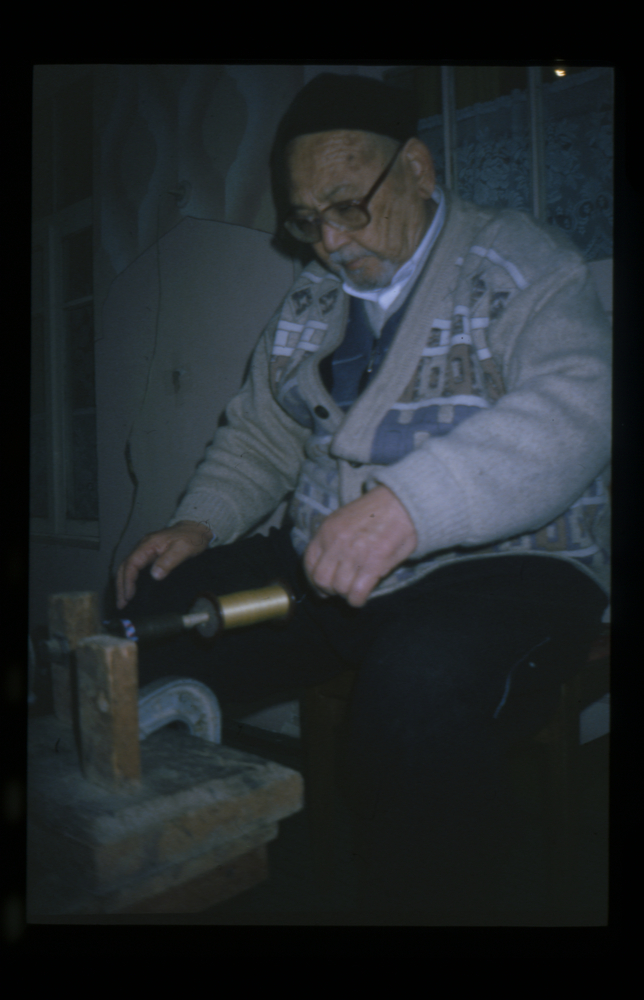 Image of Slide showing the process of silk string manufacture by Rihzhon Khojakhanov and his family