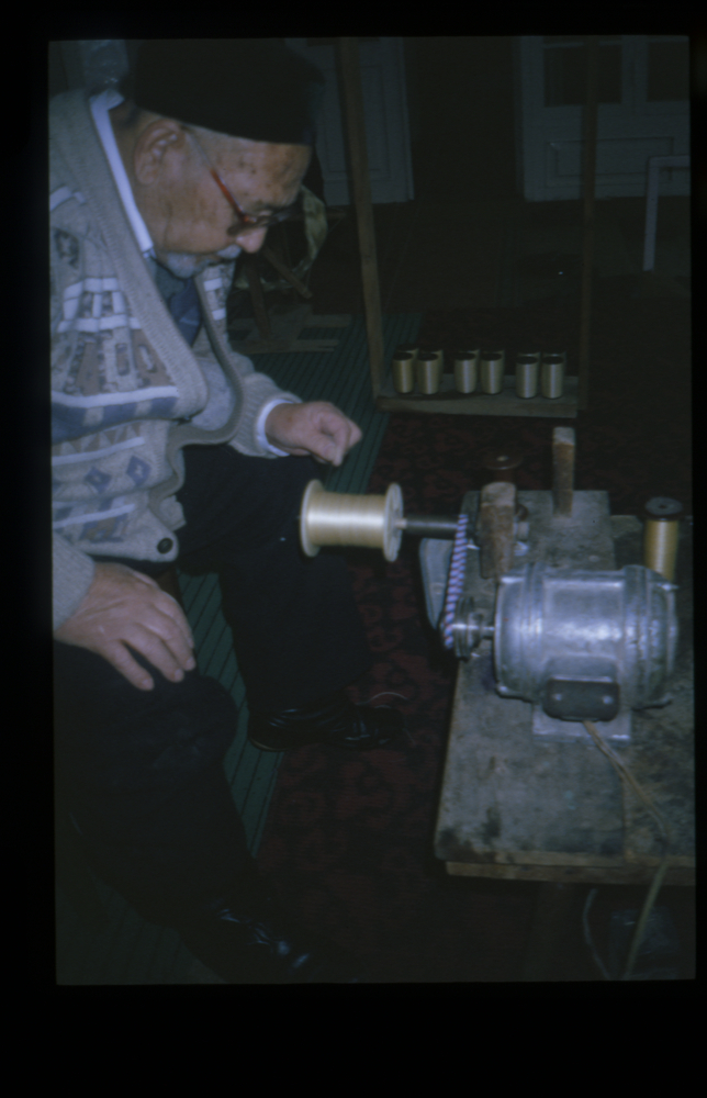 Image of Slide showing the process of silk string manufacture by Rihzhon Khojakhanov and his family