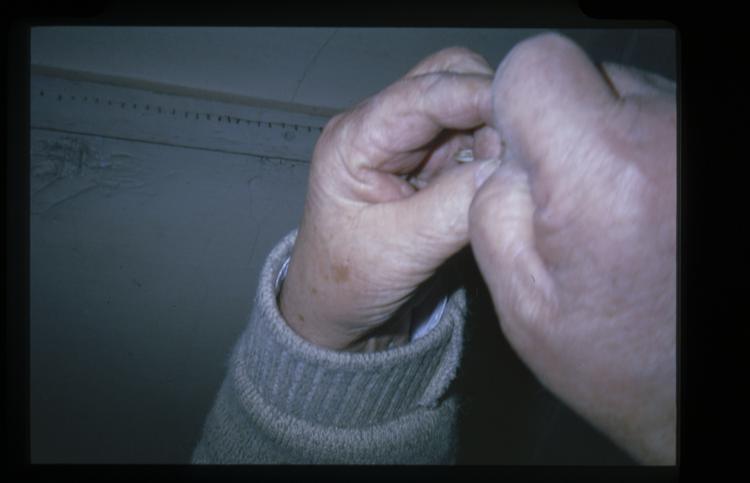 Image of Slide showing the process of silk string manufacture by Rihzhon Khojakhanov and his family