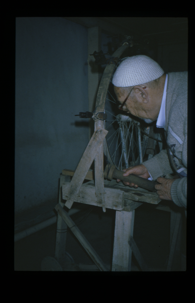 Image of Slide showing the process of silk string manufacture by Rihzhon Khojakhanov and his family