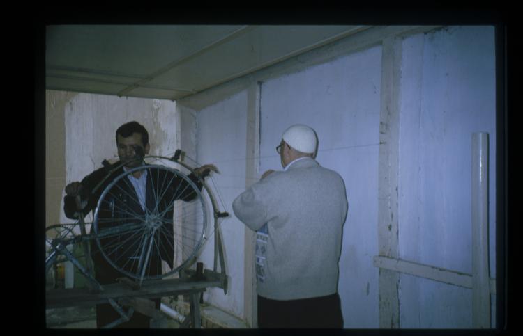 Image of Slide showing the process of silk string manufacture by Rihzhon Khojakhanov and his family