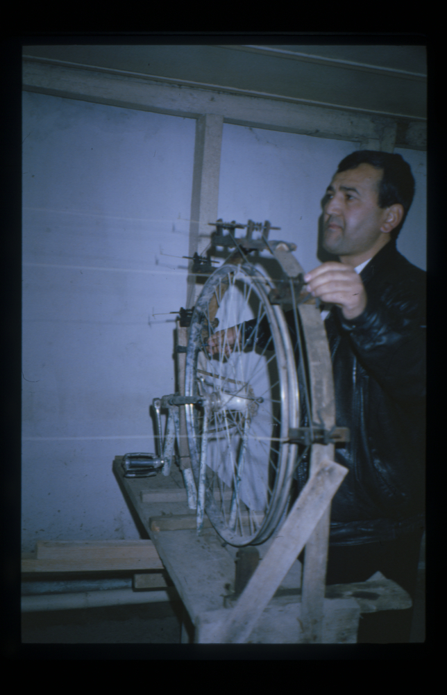 Image of Slide showing the process of silk string manufacture by Rihzhon Khojakhanov and his family