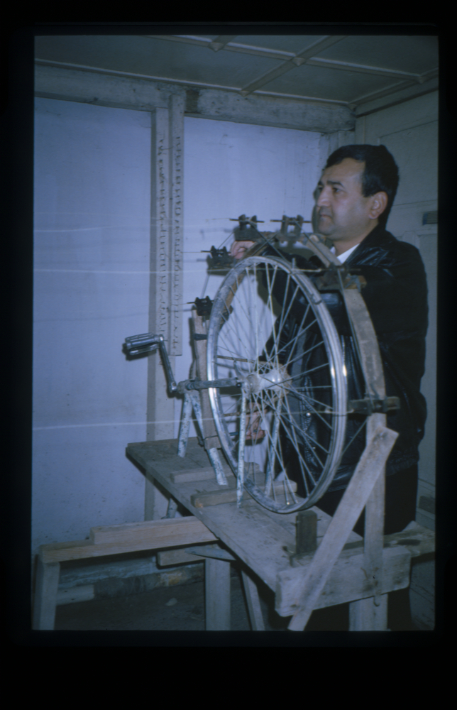 Image of Slide showing the process of silk string manufacture by Rihzhon Khojakhanov and his family