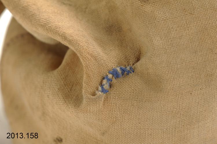 Detail view of stitching of Horniman Museum object no 2013.158