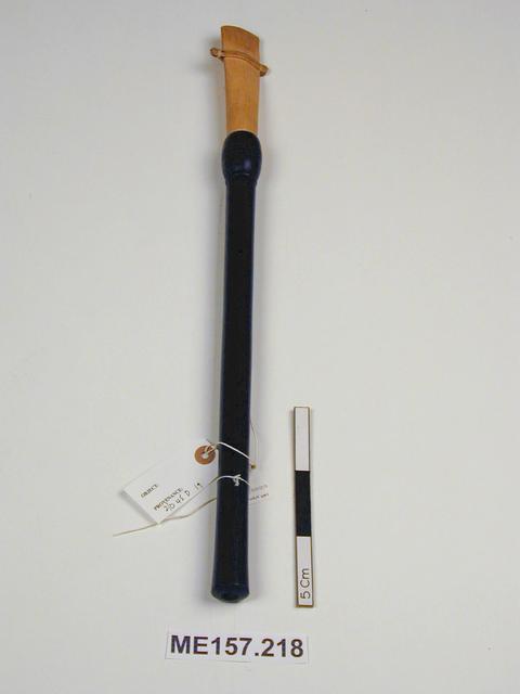 General view of object no. 2001.443. Image of reed pipe (museum no. 2001.443.1).