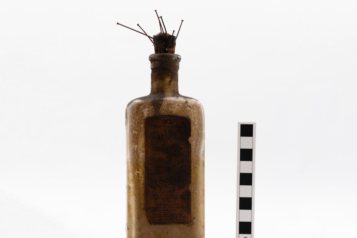 Bottle with pins in the top