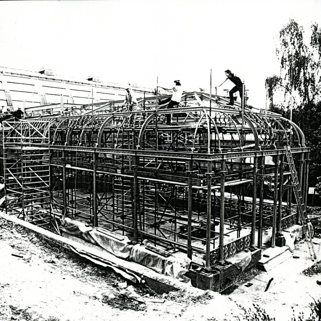 3 people standing on building works of conservatory