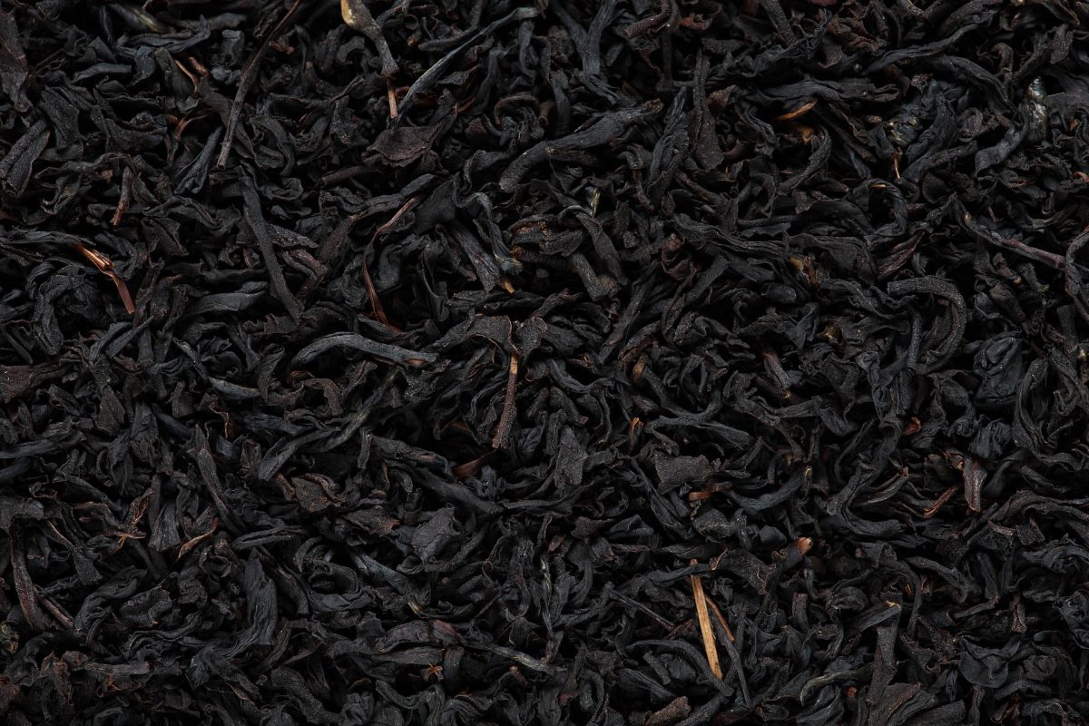 A close up of thousands of black tea leaves