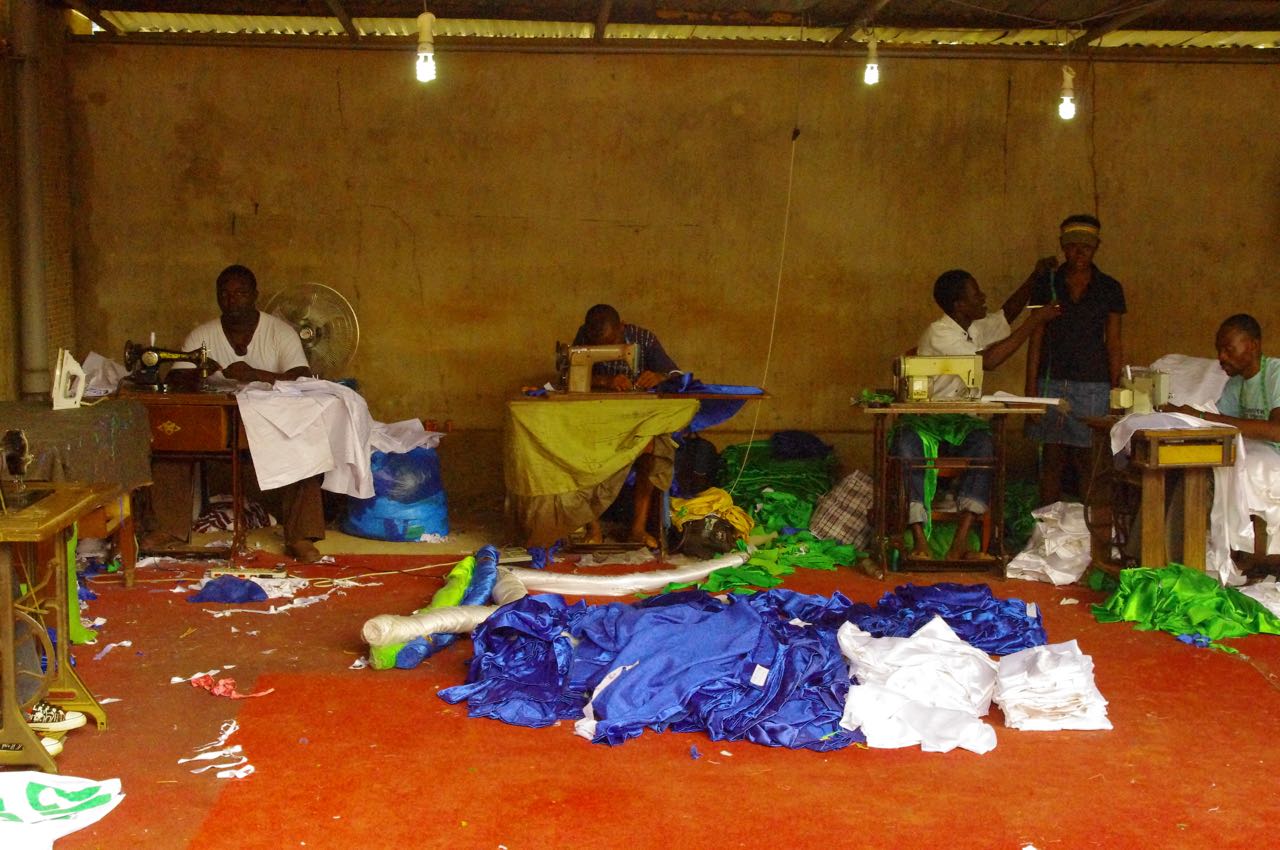 image of people using sewing machines.