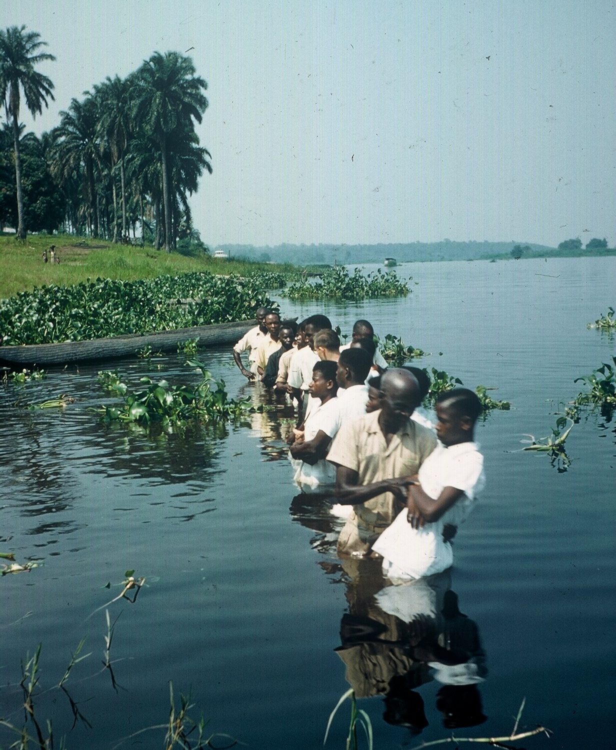 Photograph of people in river