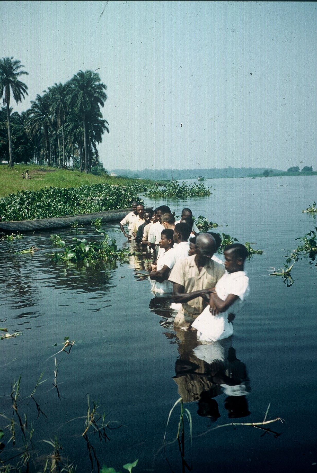 Photograph of people in river