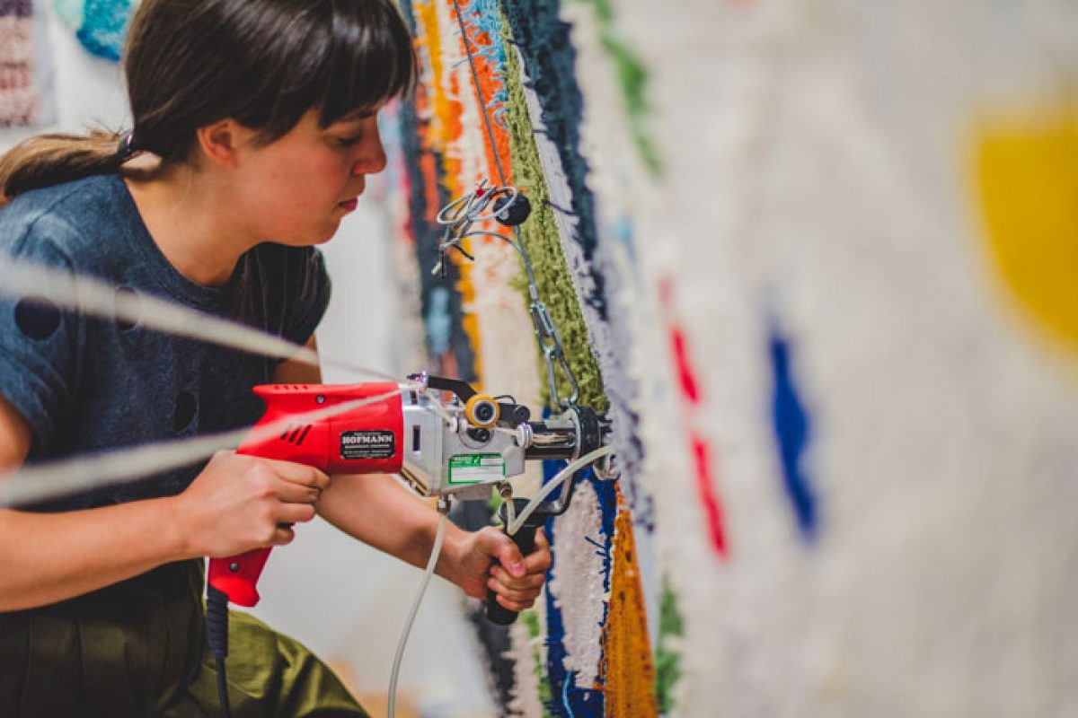 Woman using staple gun on