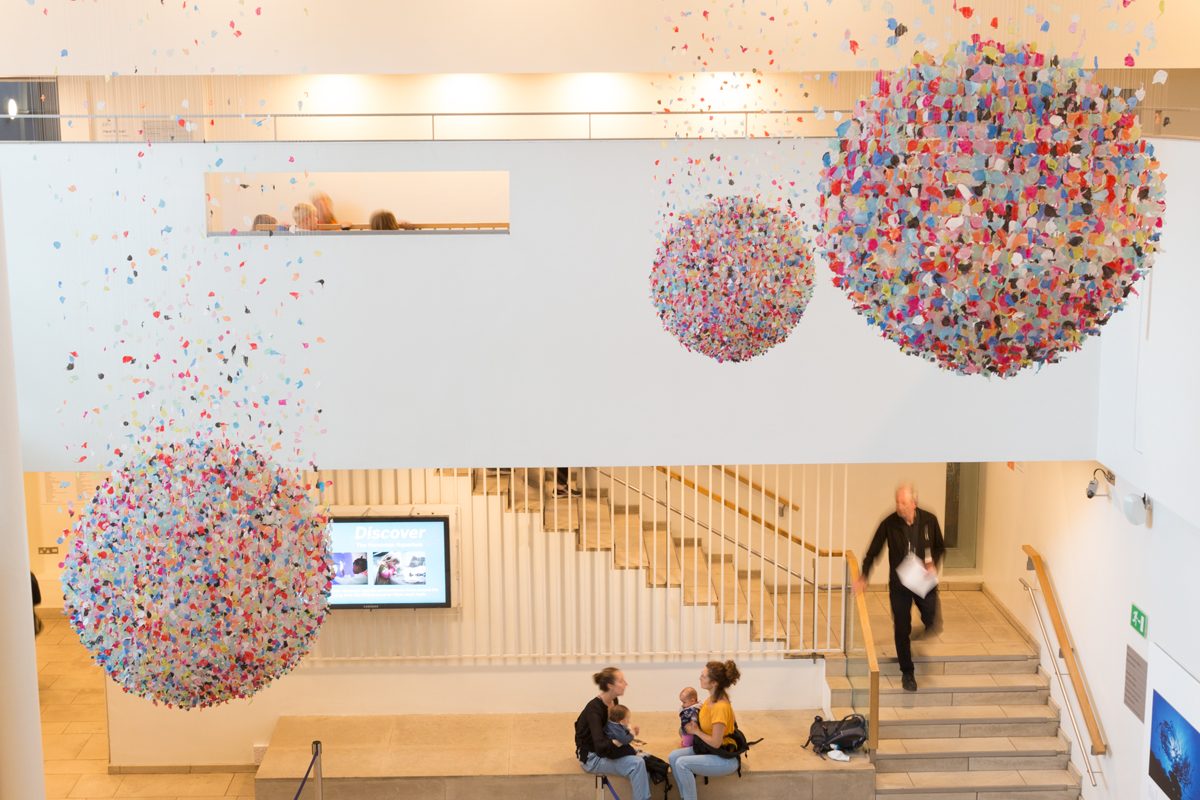 Three spheres suspended from ceiling.