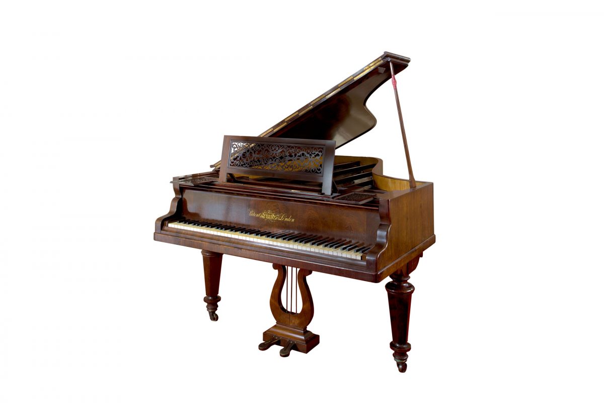 A wooden piano with an open top