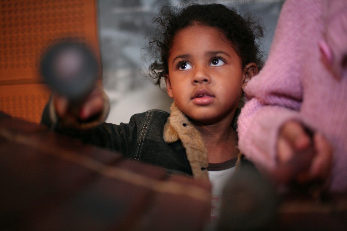 A girl playing a xylophone