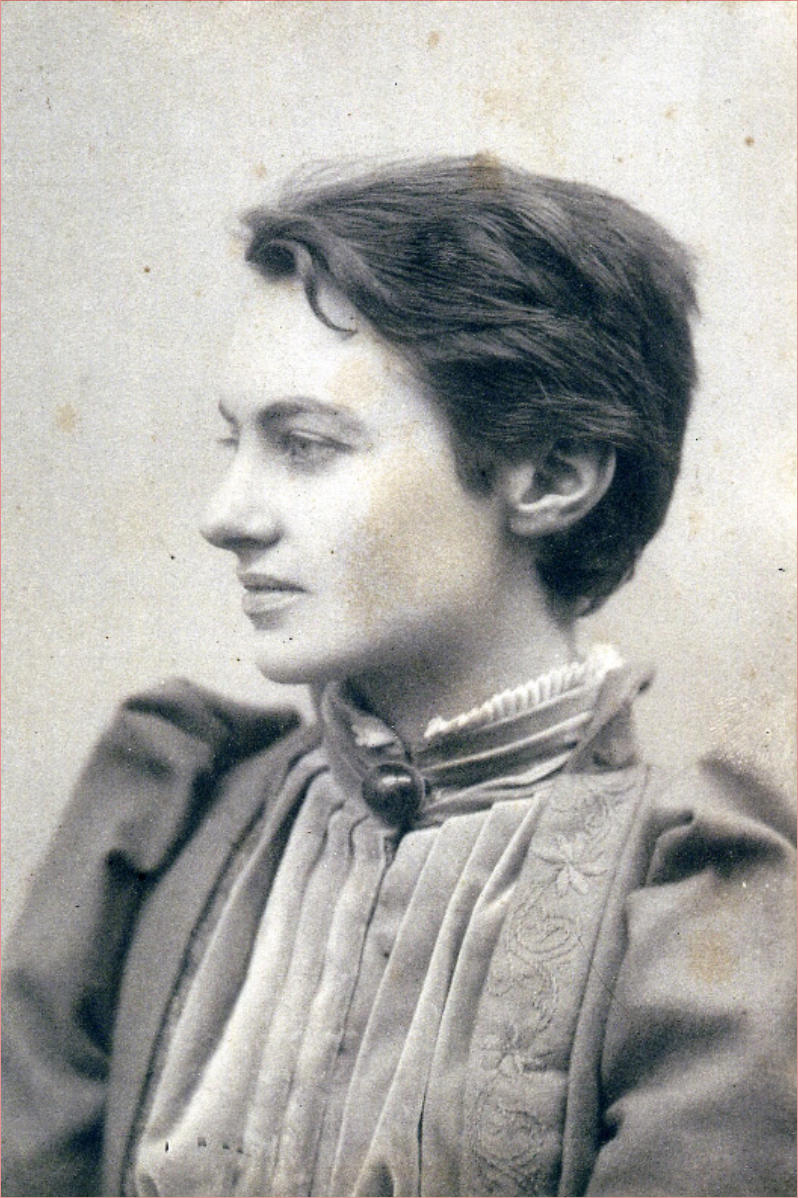 A black and white photo of a woman looking to the left of the camera