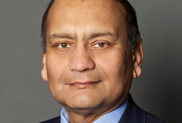 Portrait image of man wearing suit and tie