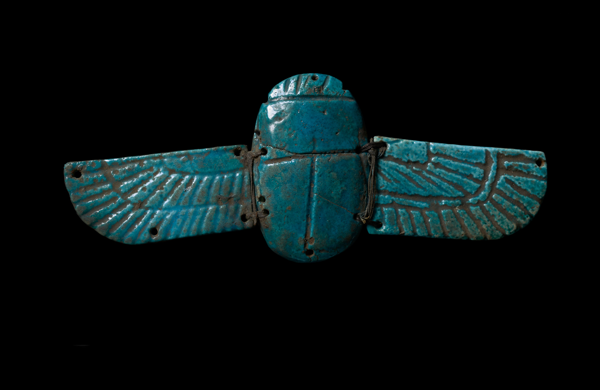 A blue jade coloured scarab trinket