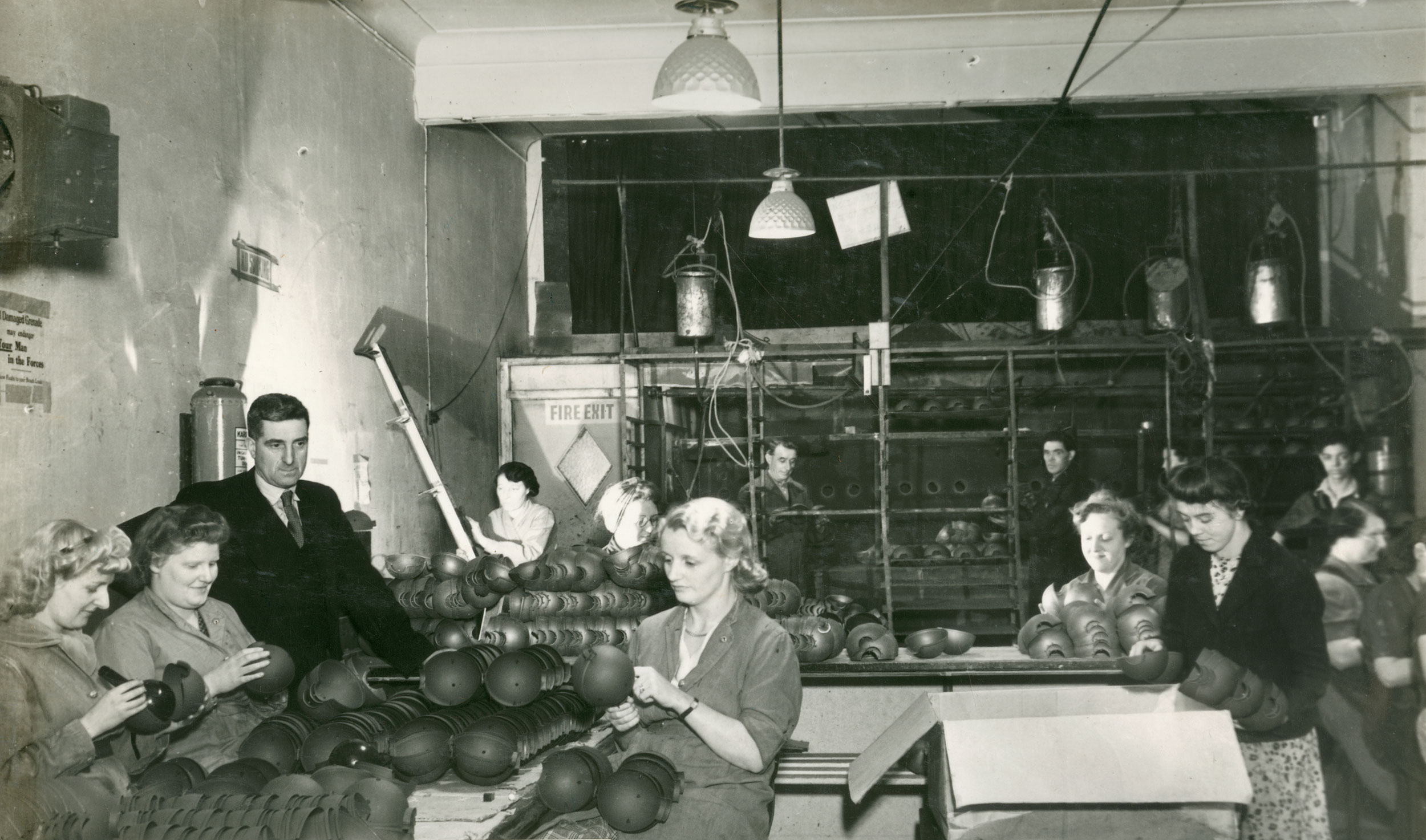 People inspecting bombs
