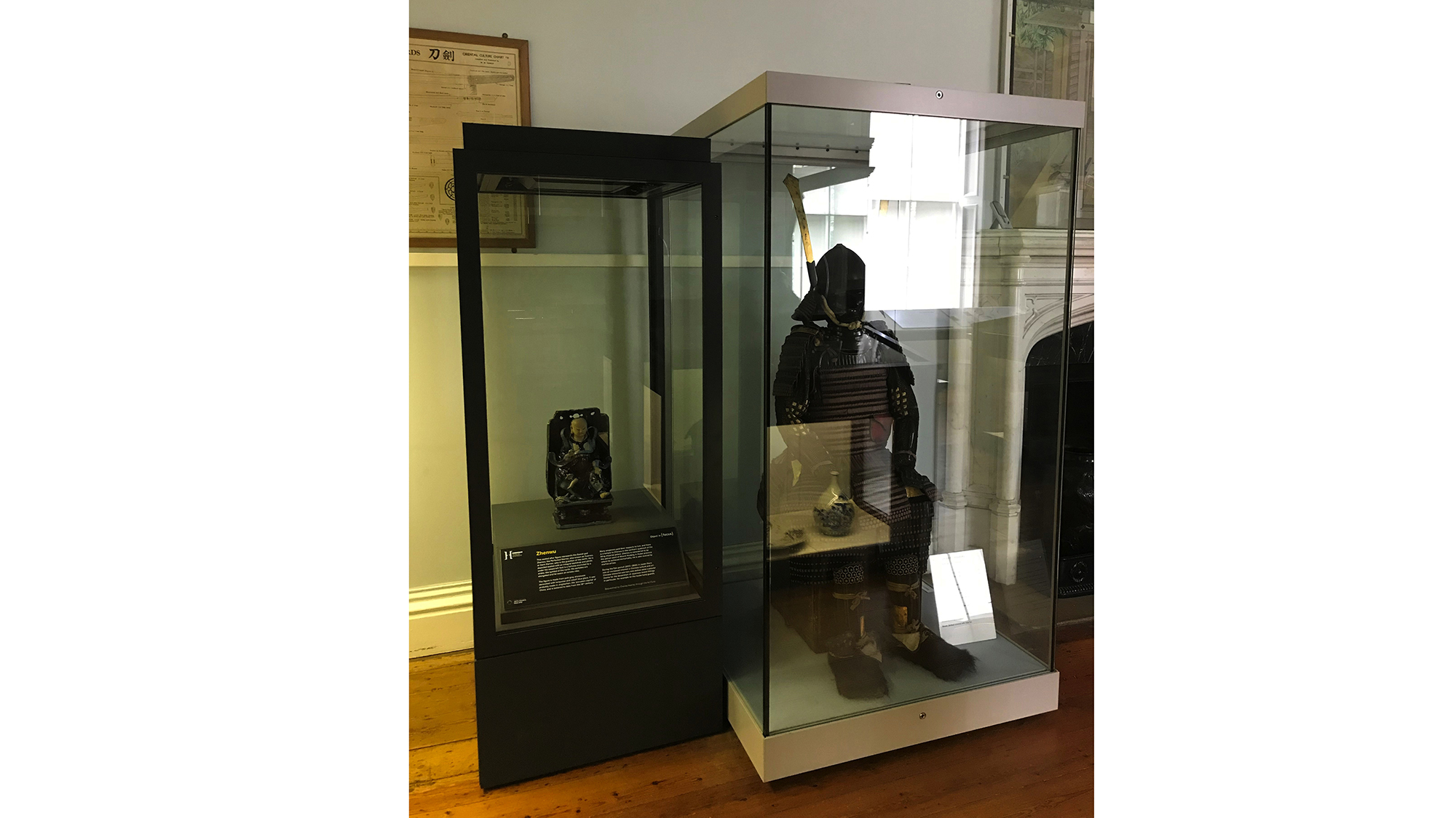 figure on display next to samurai armour