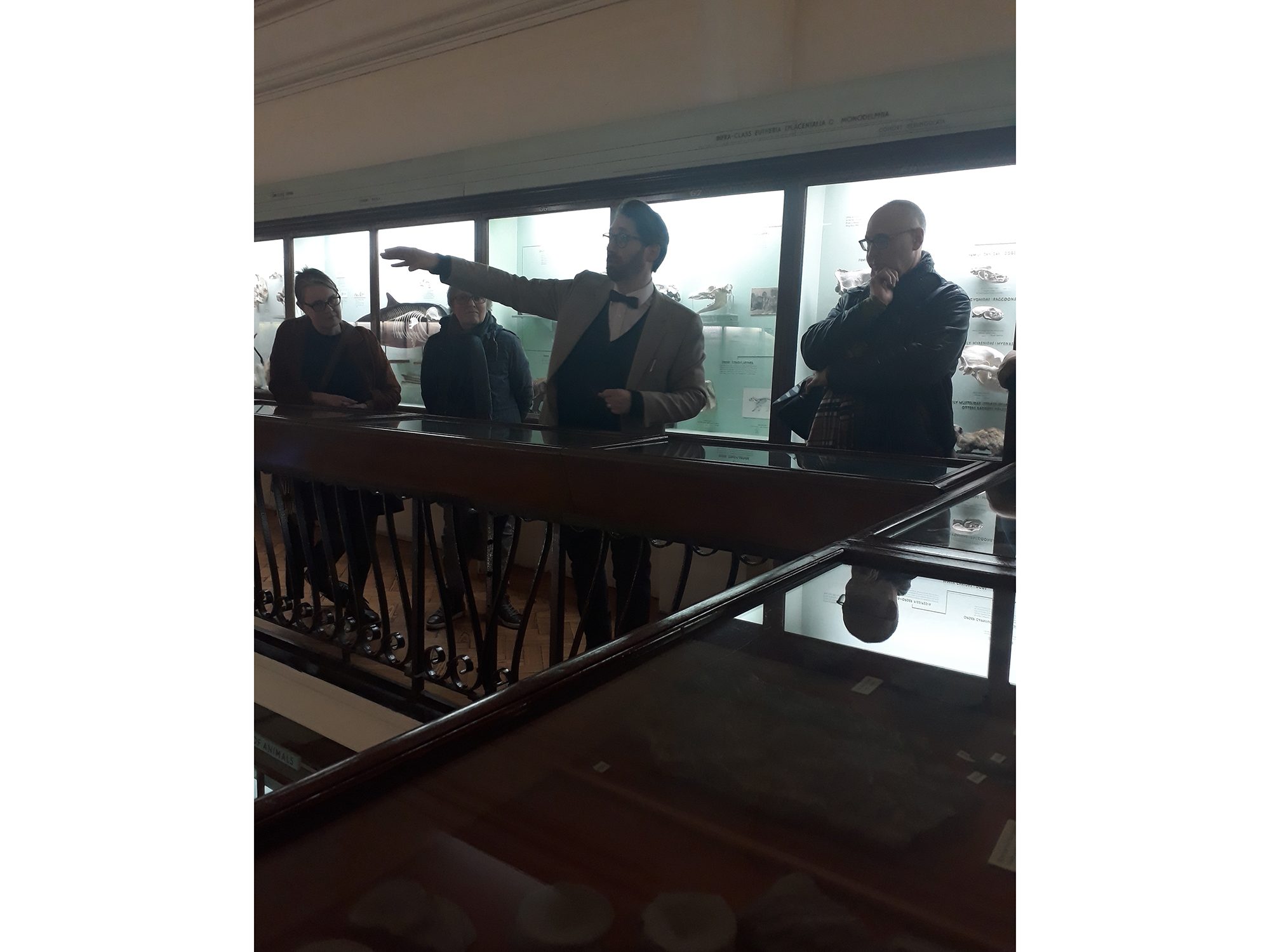Man talking on balcony to visitors