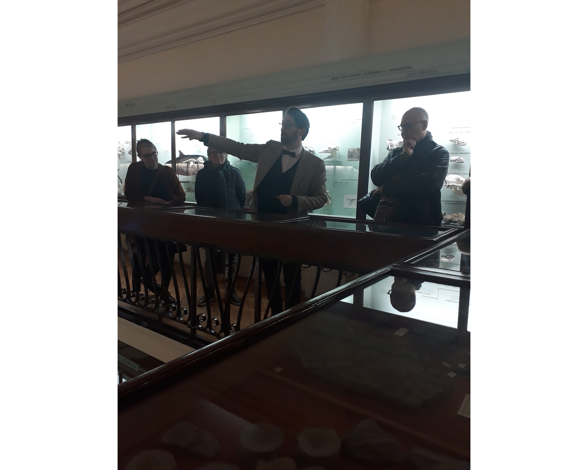 Man talking on balcony to visitors