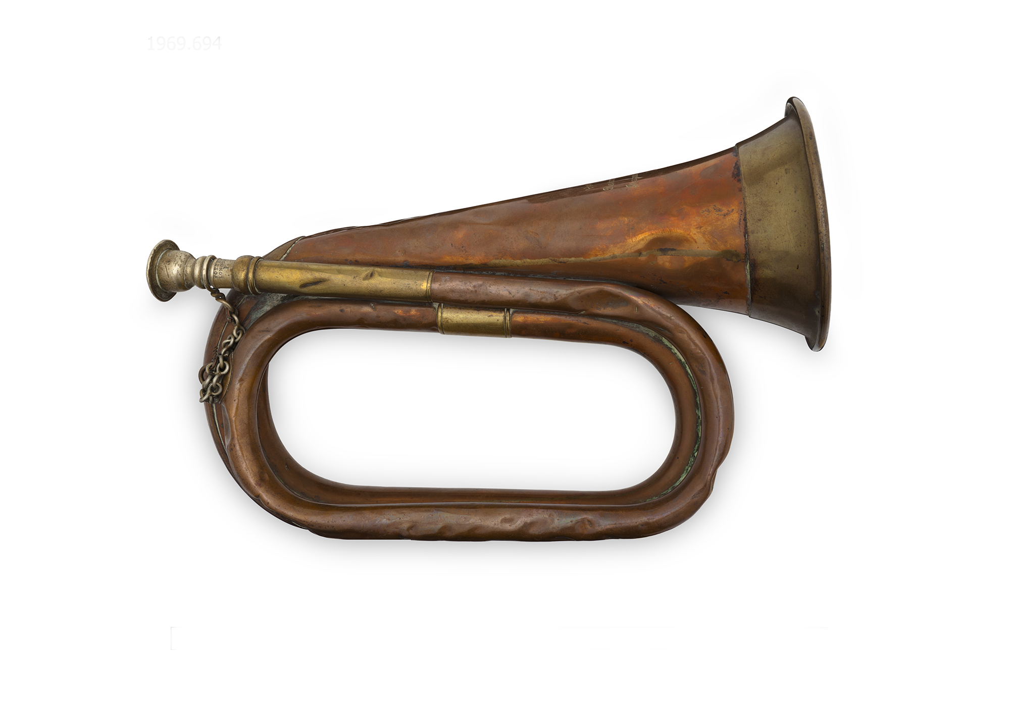 Wind instrument shaped like a curved horn, made from brass. The instrument is on a white background