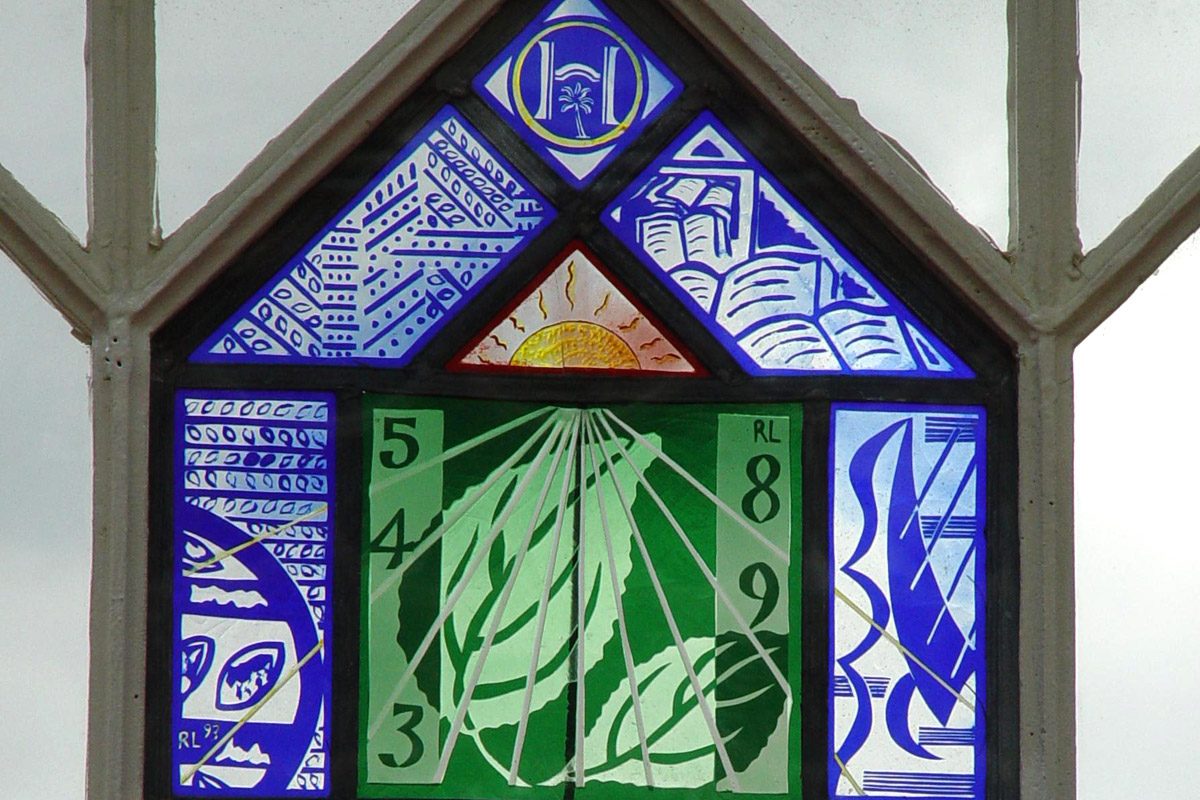 A stained glass panel, which is also a sundial