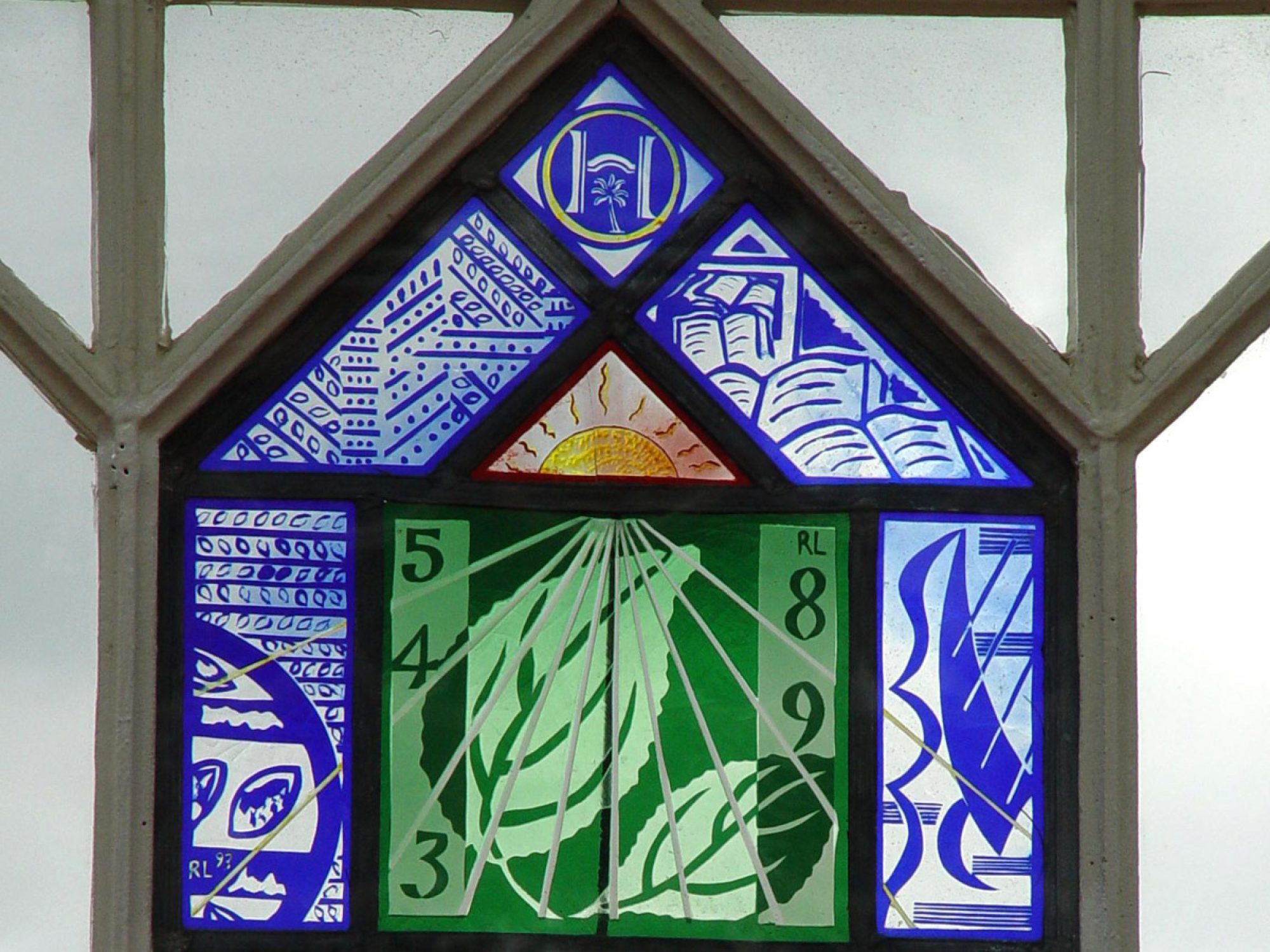 A stained glass panel, which is also a sundial