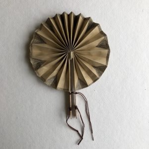 Circular fan with holding sticks.