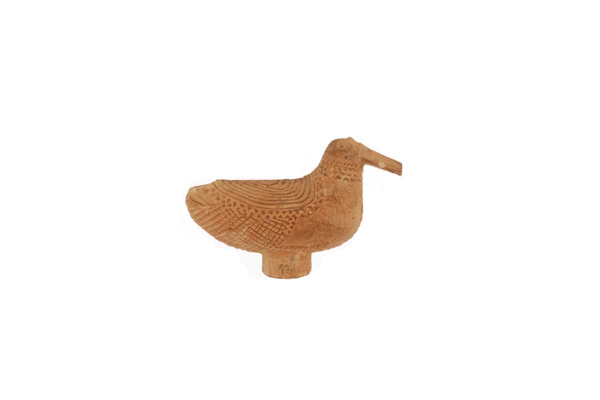 Small wooden duck figurine decorated with swirling pattern