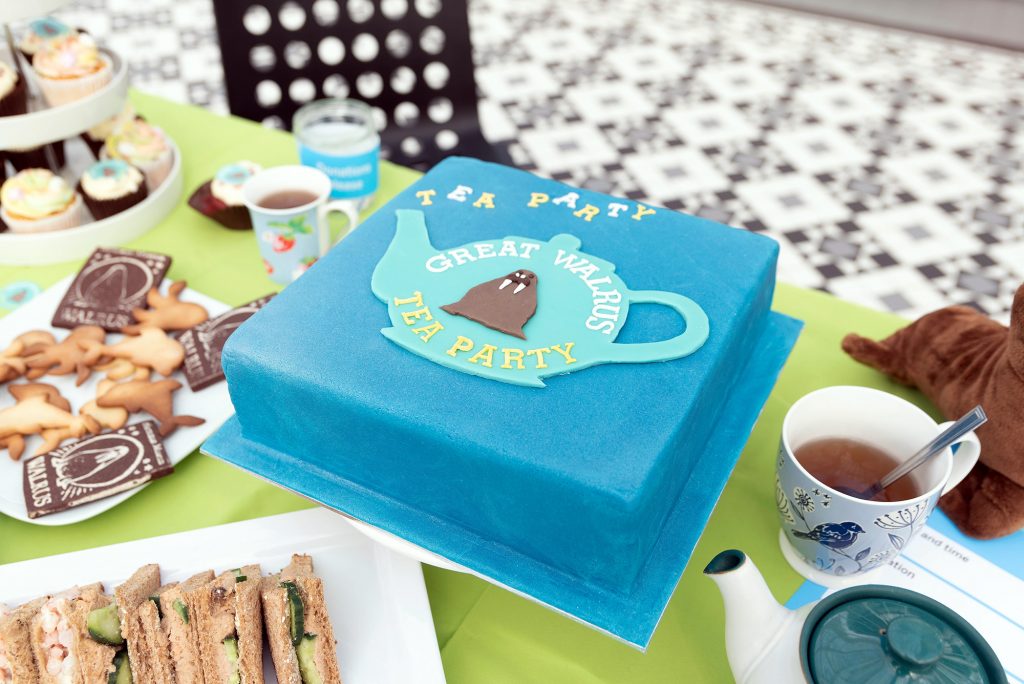 Large blue cake at a tea party