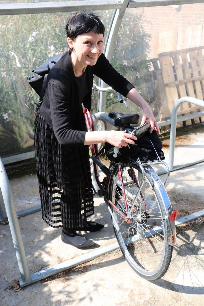 Cookie locks her bike up 