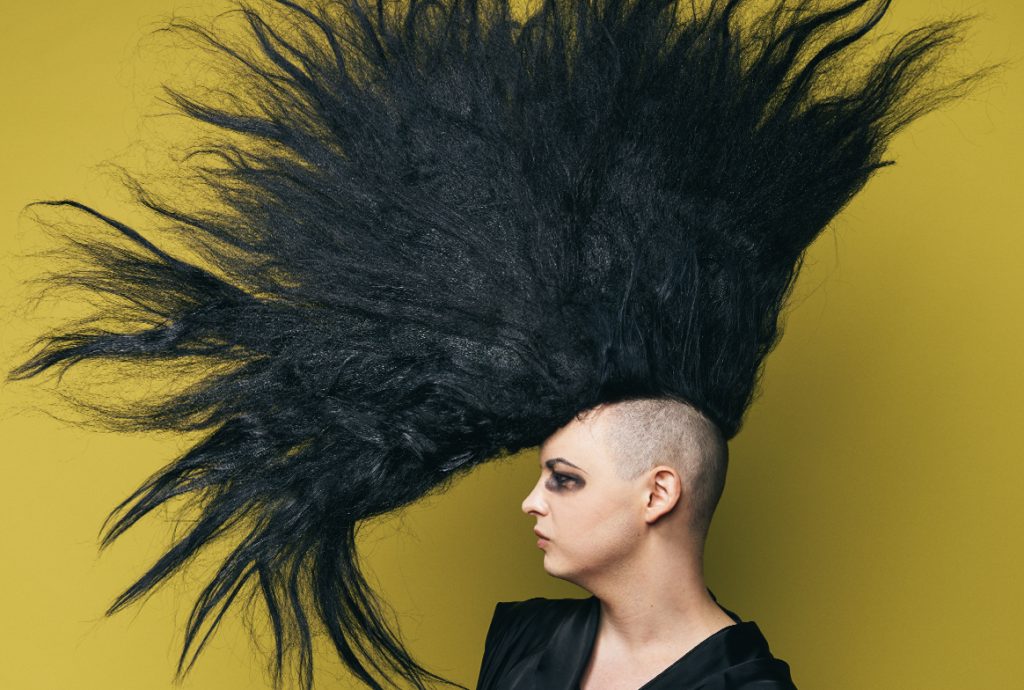 A person with a black mohawk