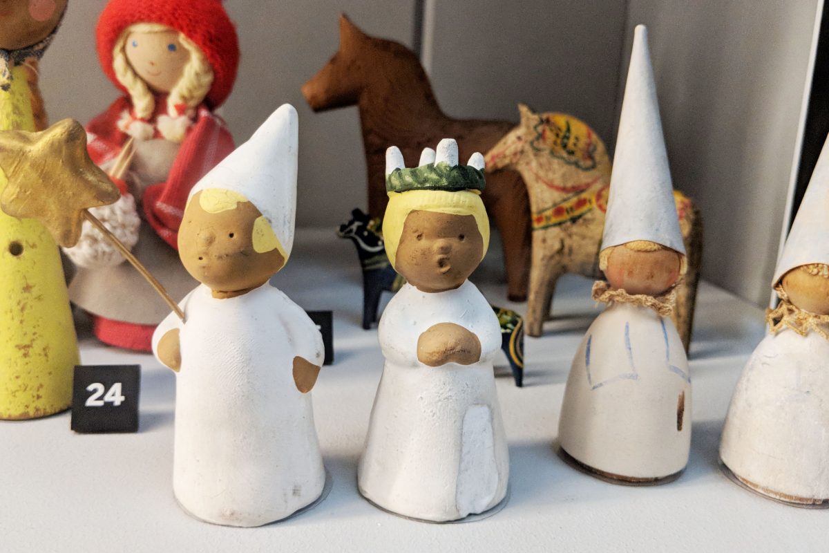 Small wooden toy figures of lucia and her attendants