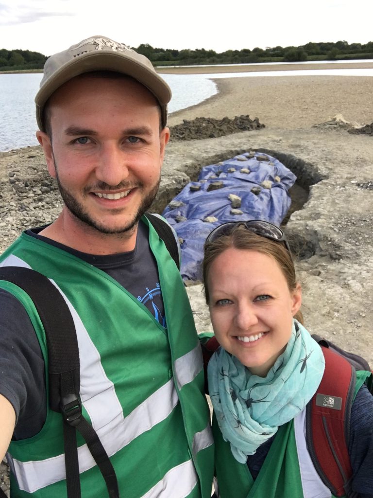 Dean and Emma in front of the fossil