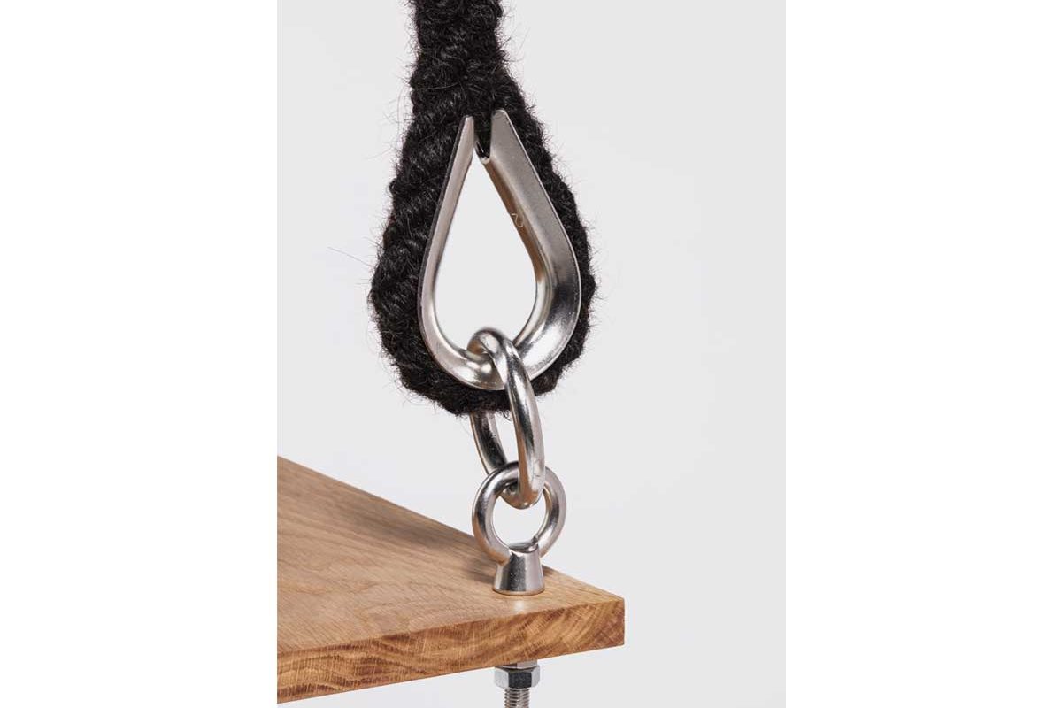 Corner of a swing with ropes made from hair