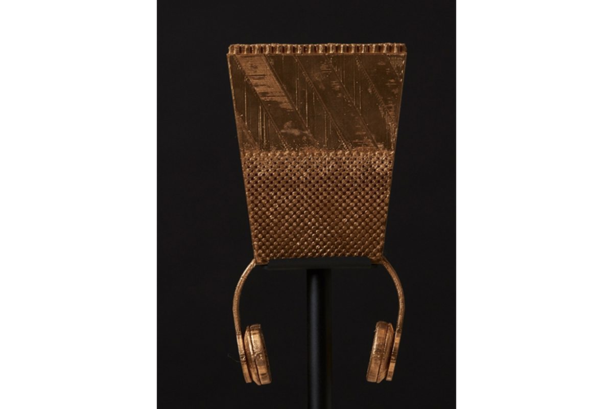 Golden headphones with an Egyptian style rectangle headpiece at the centre