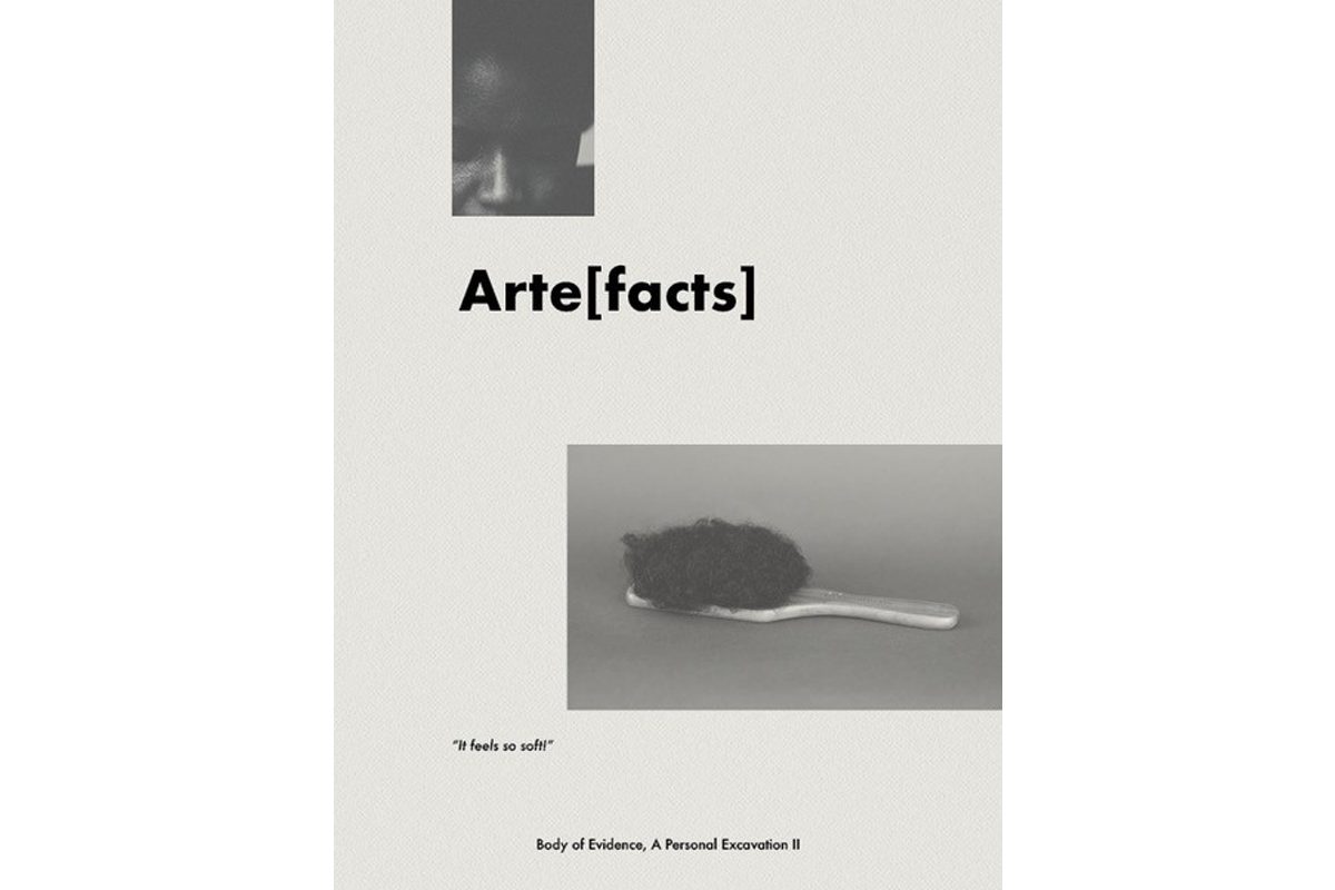 A photo of dreadlocked hair in the top right corner, and below that text which reads 'Arte[facts]'. Below that a hairbrush where the brush part is afro hair. Text below reads ‘It feels so soft! Body of Evidence, a Personal Excavation II'