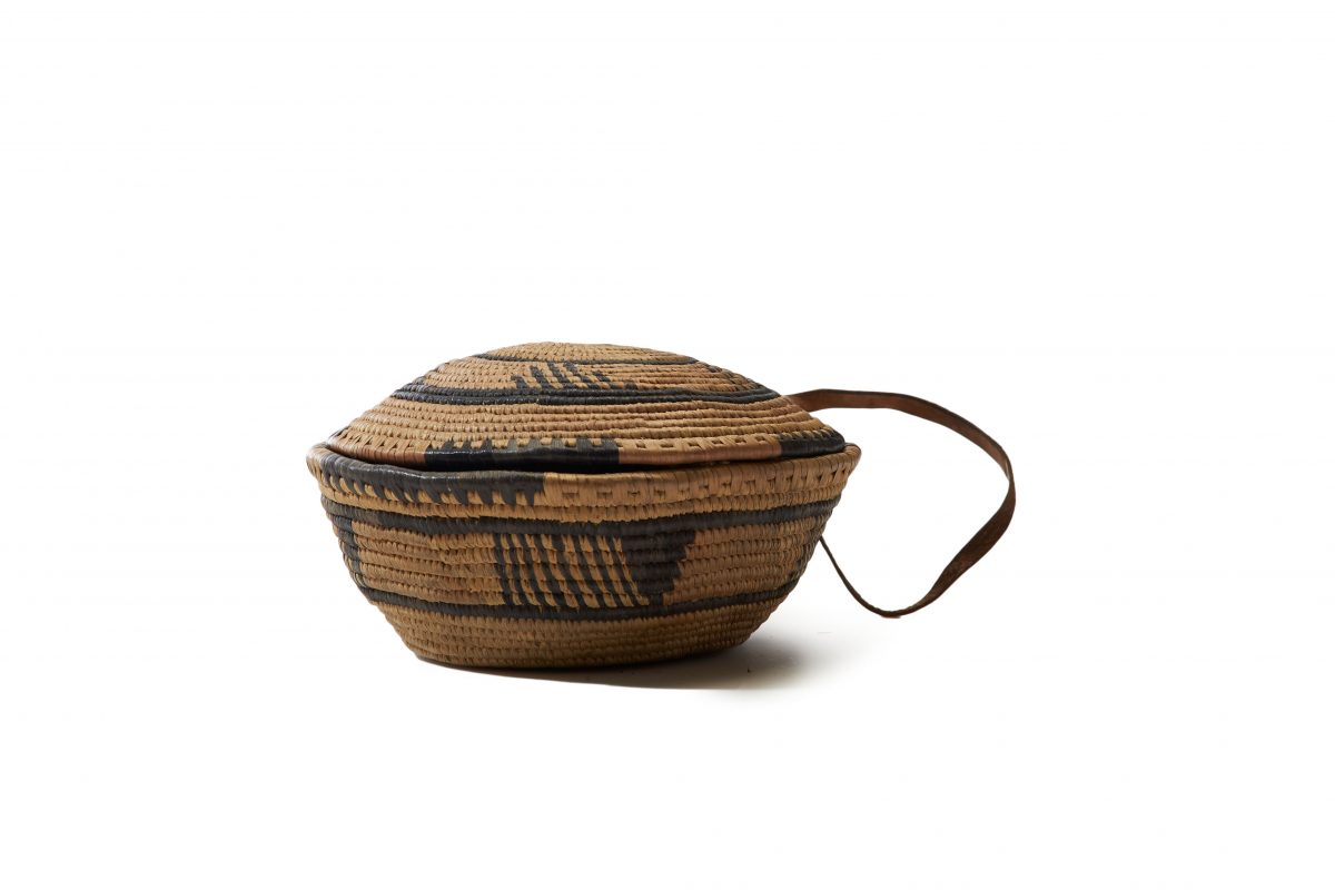 A woven basket and lid