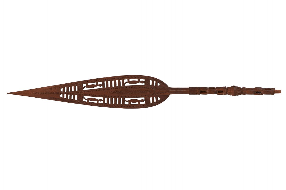 A carved wooden paddle