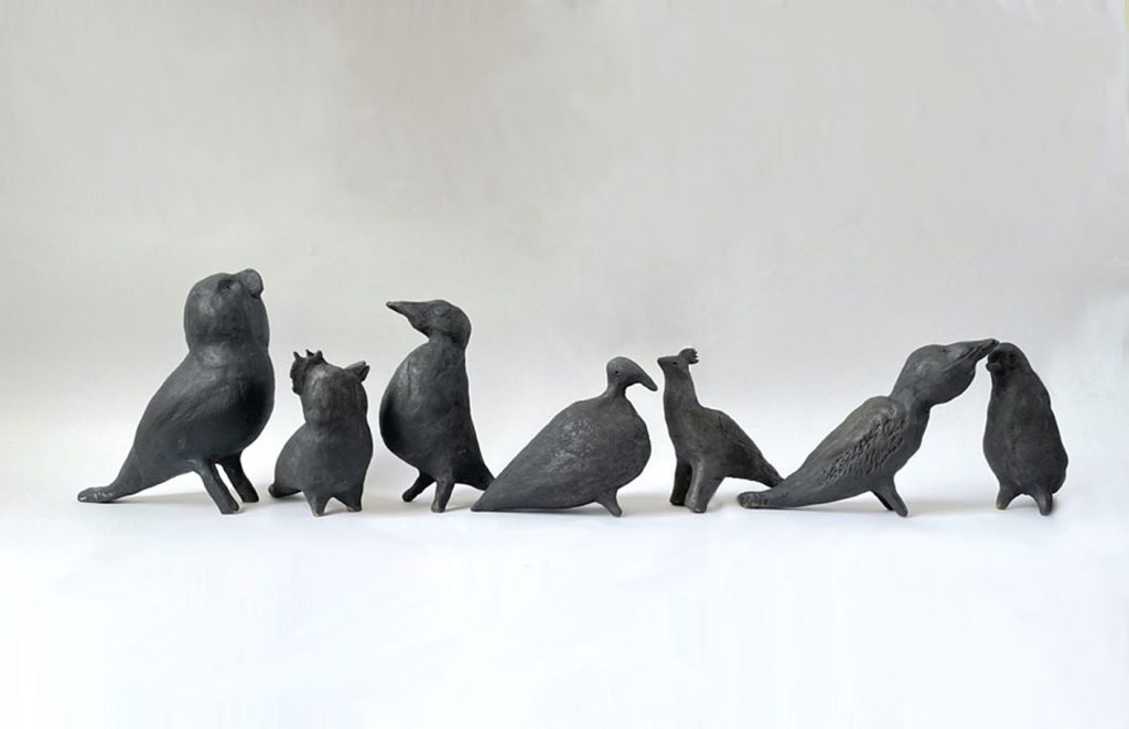 Seven bird models made out of clay