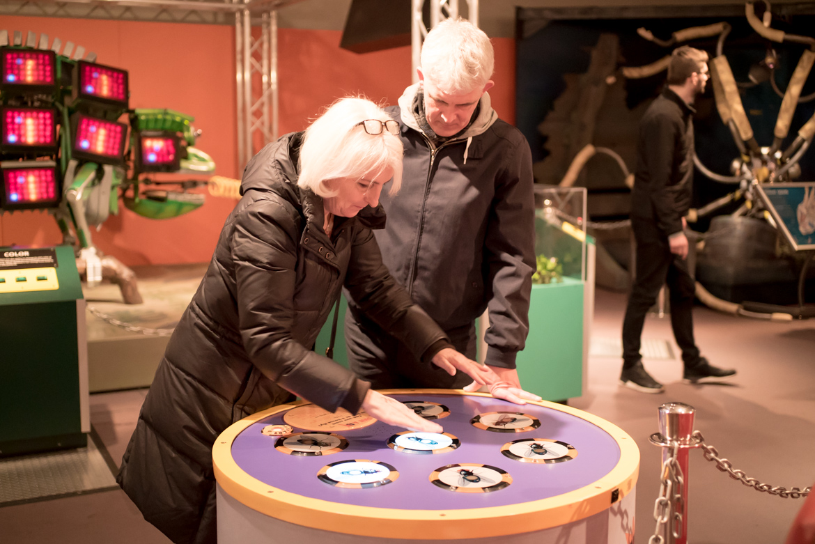 A man and woman play with an interactive display at the Horniman Museum