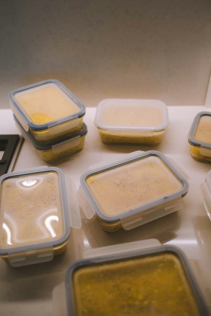 Various frozen tupperware containers filled with food